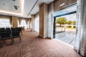 a conference room with a table and chairs at Real Marina Hotel & Spa in Olhão