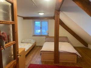 Postel nebo postele na pokoji v ubytování Apartmány Dolní Vítkov
