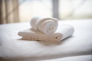 Postel nebo postele na pokoji v ubytování Stadshotel Doesburg