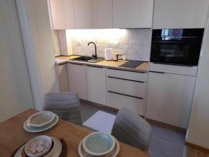 Eldhús eða eldhúskrókur á Relax sauna apartman