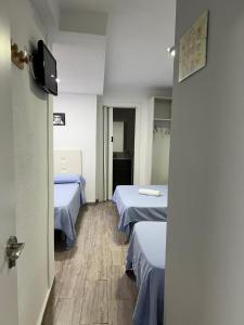 Postel nebo postele na pokoji v ubytování Guesthouse Central