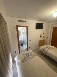Postel nebo postele na pokoji v ubytování Hotel Posada del Mar Playa de Gandía