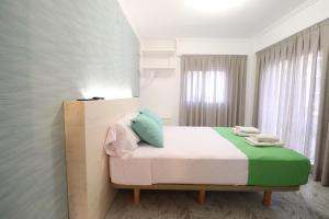 Postel nebo postele na pokoji v ubytování Hotel Posada del Mar Playa de Gandía