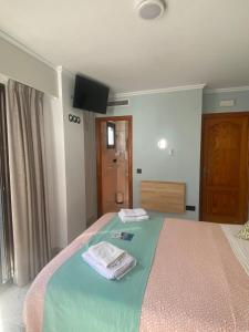 Postel nebo postele na pokoji v ubytování Hotel Posada del Mar Playa de Gandía