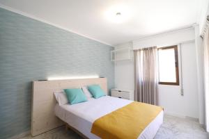 Postel nebo postele na pokoji v ubytování Hotel Posada del Mar Playa de Gandía