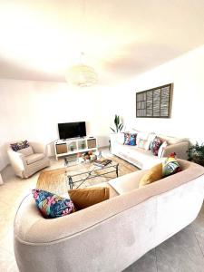 a living room with a couch and a table at Villa Tonia in Cala en Blanes +42 photos