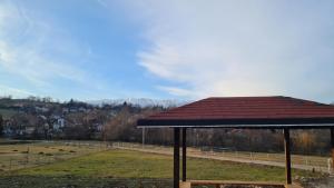 a roof on a building in a field with cows at Casa Cosmo in Cheia