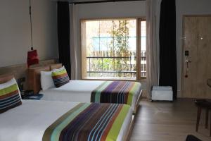 Postel nebo postele na pokoji v ubytování Hotel Bo