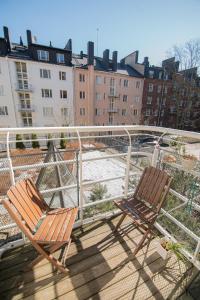 two chairs sitting on top of a balcony at Giraffe Loft in Helsinki +20 photos