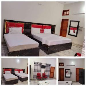 a hotel room with two beds and red accents at Royal Villa in Karachi