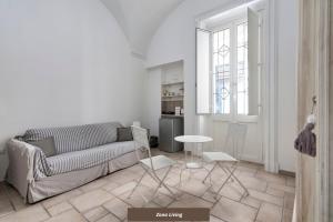 a living room with a couch and a table at Antoglietta 19 Old Town - Lecce Selection in Lecce