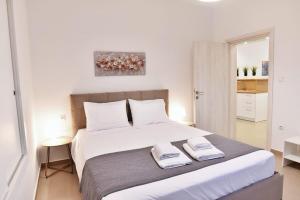 En eller flere senge i et værelse på Adams Suite 2