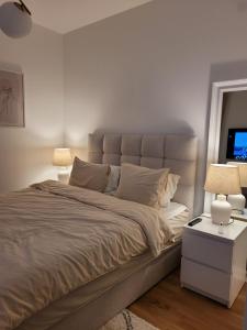 Ένα ή περισσότερα κρεβάτια σε δωμάτιο στο Knezev Park Apartment