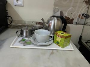 Příslušenství pro přípravu čaje a kávy v ubytování My Flat 2