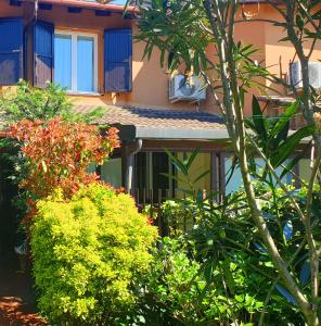 a building with a bunch of plants in front of it at House of Millepini Relax Near Milan in Rodano