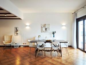 a dining room with a table and chairs at 2D Lake View in Verbania