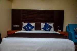 A bed or beds in a room at Otk's Apartment