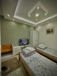 Postel nebo postele na pokoji v ubytování Vila Veljković - Sobe & apartmani " Ljupče "