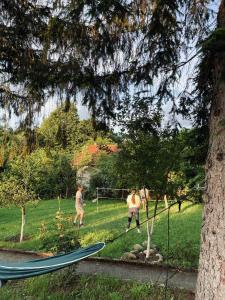 a group of people playing soccer in a yard at Къща за гости Клонката in Dŭlbok Dol