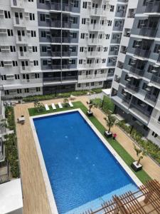 Πισίνα στο ή κοντά στο Studio Unit Condo with Balcony Behind SM CITY Iloilo