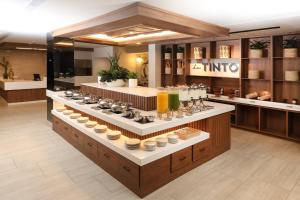 a store with a counter with bowls and dishes at voco Hermosillo by IHG in Hermosillo