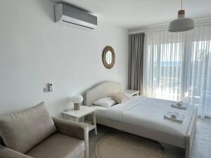 Ένα ή περισσότερα κρεβάτια σε δωμάτιο στο Relaxing apartaments near the sea +214 φωτογραφίες