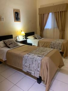 Ένα ή περισσότερα κρεβάτια σε δωμάτιο στο Hostel Del Esteko