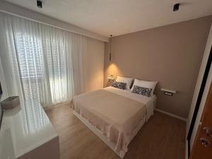 Postel nebo postele na pokoji v ubytování Apartmani Palada
