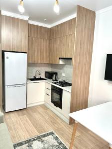 Kuchyň nebo kuchyňský kout v ubytování Airport Buta Legacy