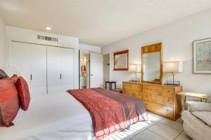 a bedroom with a bed and a mirror and a couch at 3 Mi to Dtwn Palm Springs Condo with Pool Access! in Palm Springs +18 photos