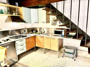 a kitchen with a sink and a stove at Indipendent house in Venice in Venice
