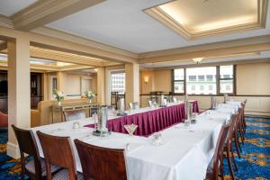a row of tables in a large room with windows at Hampton Inn & Suites Providence Downtown in Providence