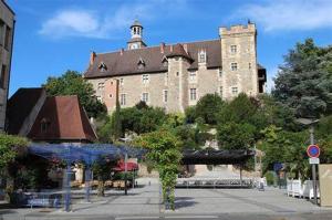 a large building with a tower on top of it at Spacieux T3 centre ville in Montluçon