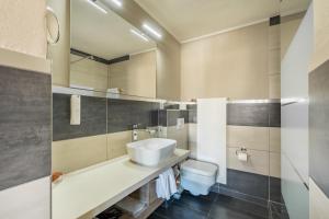 Koupelna v ubytování Hotel Beau Rivage