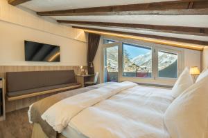 Postel nebo postele na pokoji v ubytování Hotel Beau Rivage