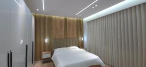 Katil atau katil-katil dalam bilik di Shkodra Trend Apartment