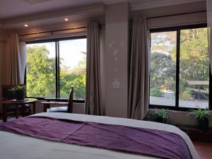 Postel nebo postele na pokoji v ubytování Park Place Hotel