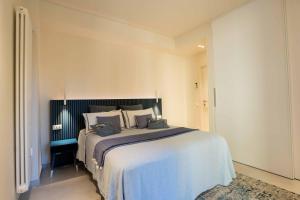 Ένα ή περισσότερα κρεβάτια σε δωμάτιο στο Casa Vacanze Angiolina-Suite W Private Box Auto