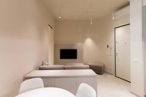 Μια τηλεόραση ή/και κέντρο ψυχαγωγίας στο Casa Vacanze Angiolina-Suite W Private Box Auto