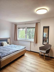 Ένα ή περισσότερα κρεβάτια σε δωμάτιο στο Apartment Wohnung Mönichkirchen