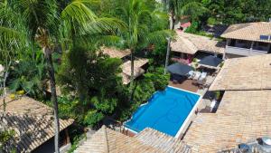 A piscina localizada em Hotel Pousada Coqueiros ou nos arredores