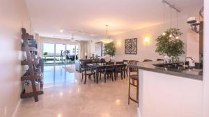 a kitchen and dining room with a table and chairs at 123 Mariners Club in Key Largo