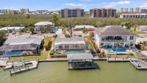 an aerial view of a house on the water at Waterfront! Canal View, dock Heated Pool - The Fair View of the Bay - Roelens in Fort Myers Beach