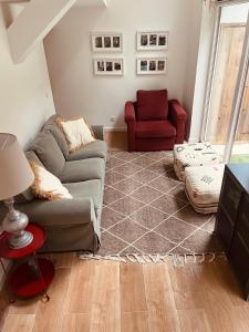 a living room with a couch and a red chair at Bloom Cottage I - Sintra montain in Sintra +23 photos