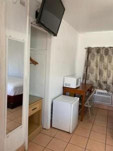 Kuchyň nebo kuchyňský kout v ubytování Sunshine Motel
