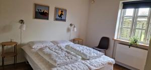 Voodi või voodid majutusasutuse Pilehuset toas