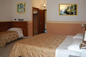 Postel nebo postele na pokoji v ubytování Hotel Ristorante Donato