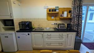 A kitchen or kitchenette at Skellig View Sunset Cliffs View Apartment