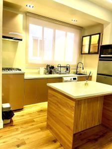 a kitchen with a sink and a counter top at Cozy Ikoyi Retreat in Lagos