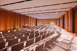 an empty lecture hall with white chairs and wooden walls at Mandarin Oriental, Bodrum in Golturkbuku +37 photos